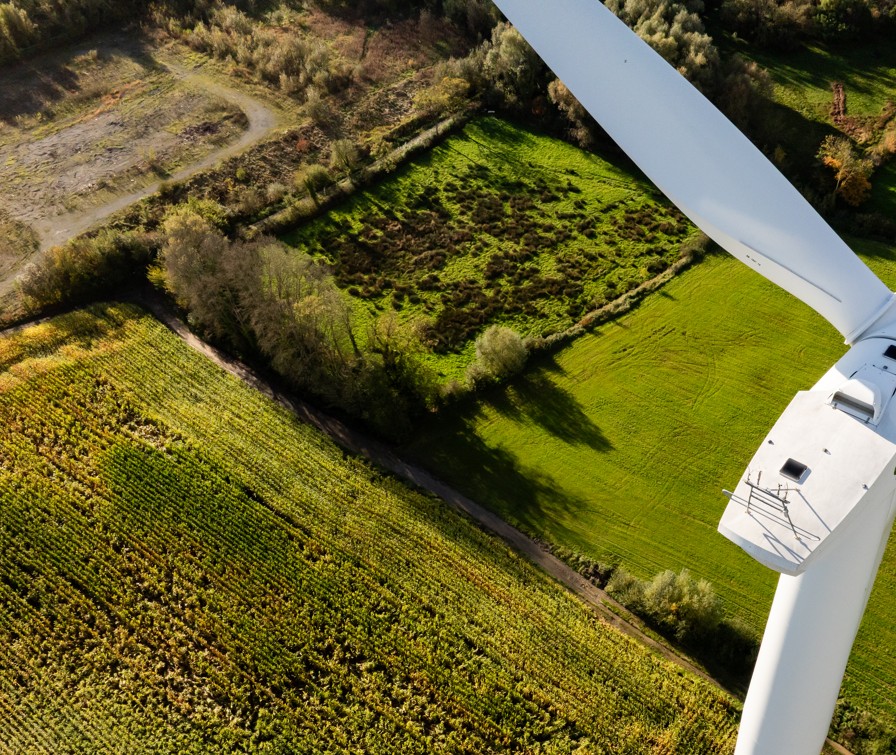 Aerial view of wind turbine and fields
