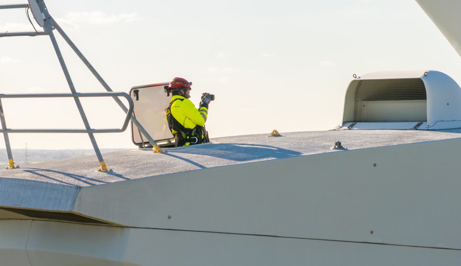 Person photographing from a boat's deck