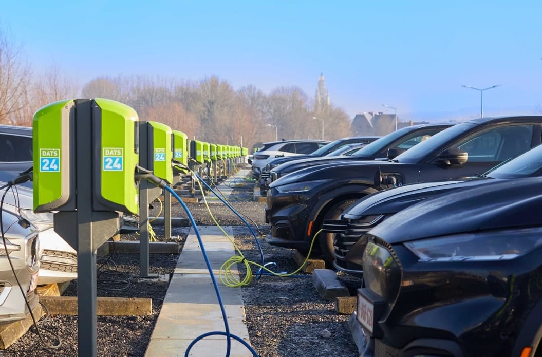 Electric vehicle charging station with cars